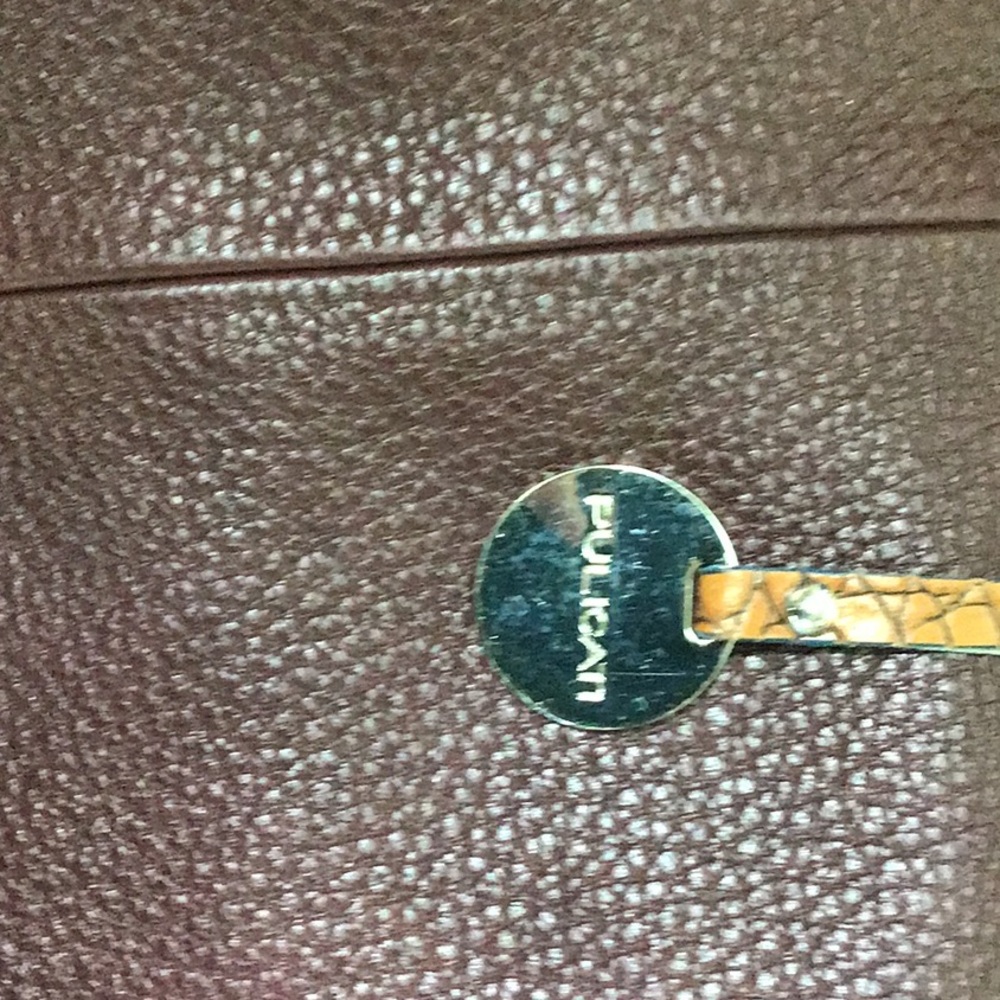 Pulicati pebbled leather maroon bag